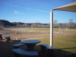 Wow! Horse ring to the left, soccer field to the right, and beautiful scenery behind.